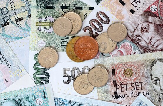 Czech koruna money banknotes and coins on table. Czech Republic cash bills of CZK currency