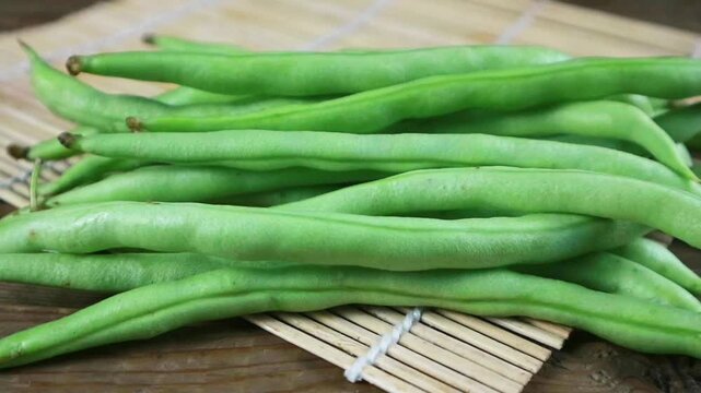 Fresh Green Bean rotation close up. Turning display