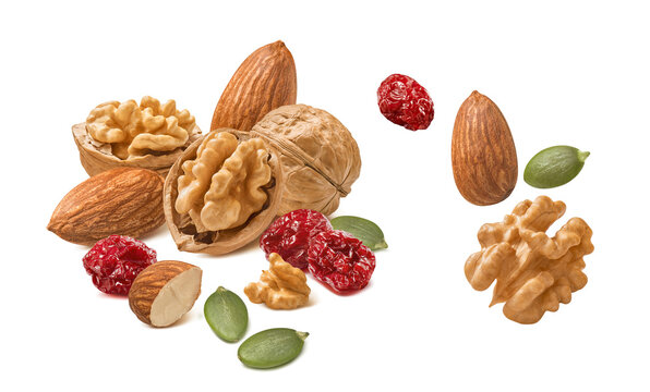 Almond and walnut nuts, dried cranberry, green pumpkin seeds isolated on white background