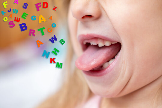 Child showing tongue, girl sticking out tongue, letter, gymnastics tongue, speech therapy, pronunciation practice session, practicing sounds, language development, speech delay, dental tongue exercise