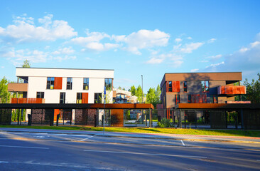 Modern contemporary apartment building with secure gated under croft parking. Development cityscape with housing in low-density. Business-class house with flats. City apartment in multi-family house © MaxSafaniuk