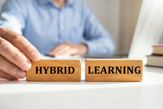 Hybrid learning concept with wooden blocks on desk, online education, blended training, remote study and modern classroom technology.