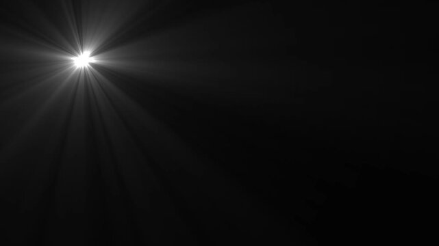 Vibrant white light source radiating across on black background scene, Bright spotlight effect with dramatic light rays and shadows for professional video productions.4k video