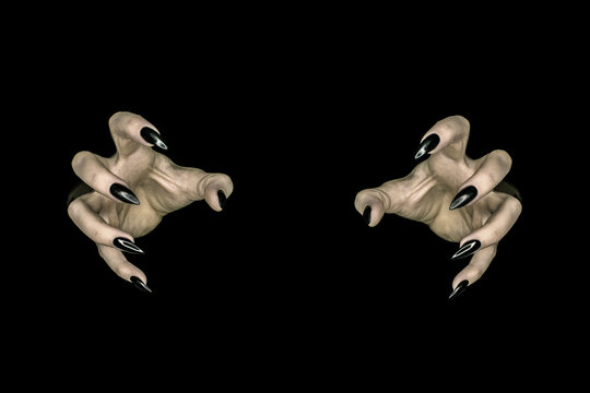 Spooky and creepy pale hands of a monster or witch reaching out from darkness with long, sharp, glossy black fingernails.
