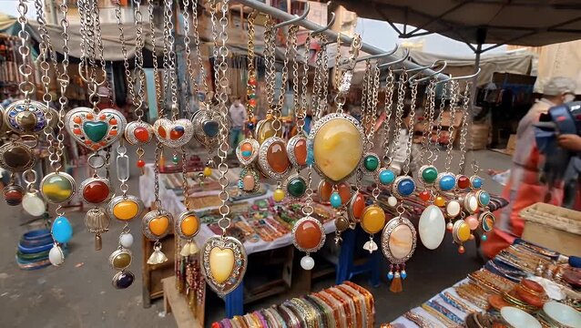 Handcrafted Adornments and Fastenings Featuring Economical Crystalline Embellishments Suspended from Necklaces Available for Purchase at an Artisanal Craft Exhibition