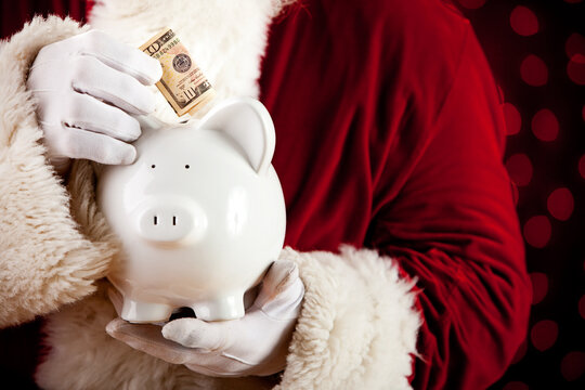 Santa: Putting Cash In Piggy Bank