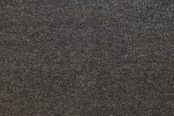 Fototapeta premium Closeup charcoal ribbed knit fabric showing soft stretch yarn, subtle vertical ribs, neutral palette suitable for minimalist wardrobe pieces, knitwear designer sample for slow fashion brands