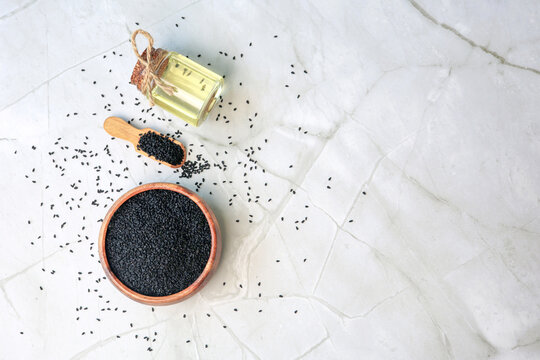 glass bottle of black cumin seeds essential oil 