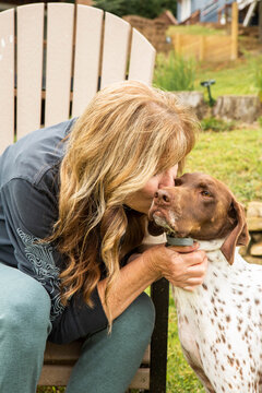 Happy Woman Playing with German Shorthaired Pointer