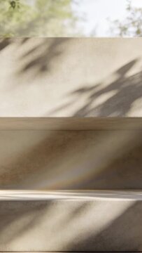 Vertical video: Shifting leaf shadows by breeze crossing stone stairs under trees, with faint arc