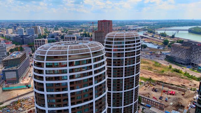 Modern oval skyscrapers at Sky Park, Bratislava, Slovakia. Close drone shot showing the unique architectural pattern of the tower roofs under bright daylight.