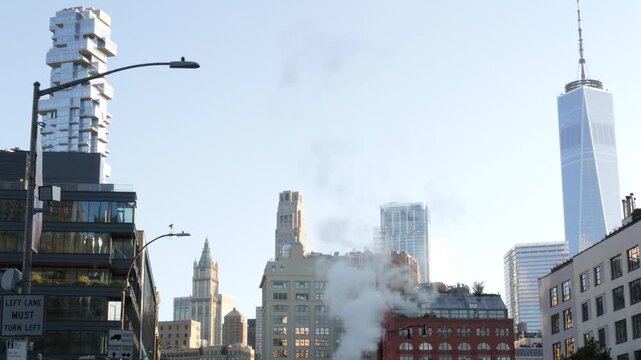 New York City Manhattan Downtown Financial District, United States of America. World Trade Center skyscraper, FiDi tower building. Modern business center. Hot steam smoke vapor. Varick street, Tribeca