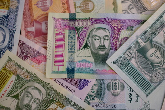 Pile of Mongolian t&ouml;gr&ouml;g (tugrik) banknotes, top view close up. Mongolian t&ouml;gr&ouml;g bills background