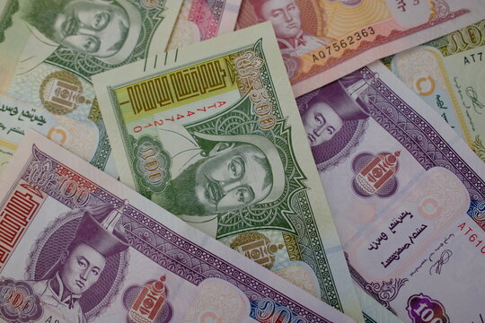 Pile of Mongolian t&ouml;gr&ouml;g (tugrik) banknotes, top view close up. Mongolian t&ouml;gr&ouml;g bills background