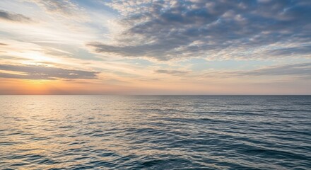 Fototapeta premium Vast Ocean Horizon at Sunset with Dramatic Clouds.