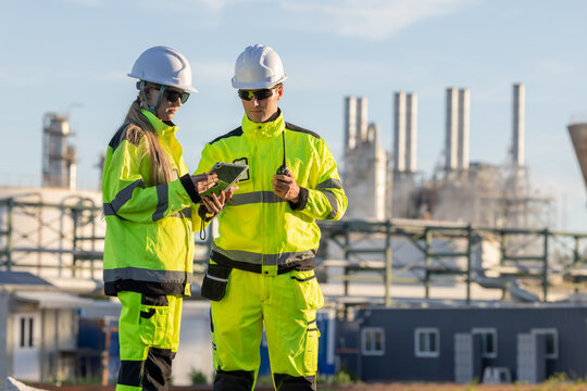 Group of petroleum engineers having a discussion at the site
