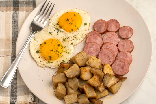 fried eggs with kielbasa  and home fries