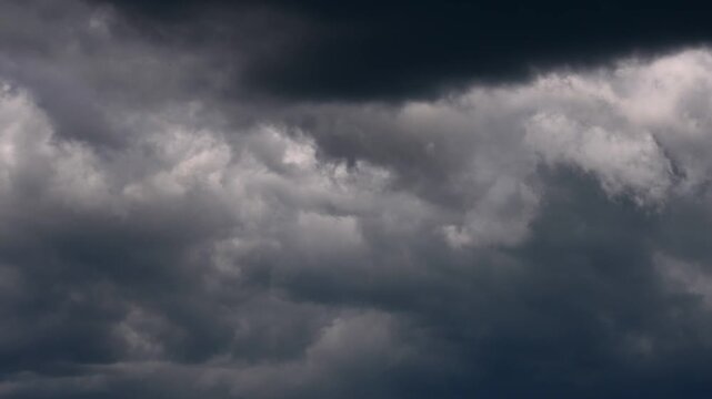 Dark storm clouds moving across sky in dramatic timelapse
