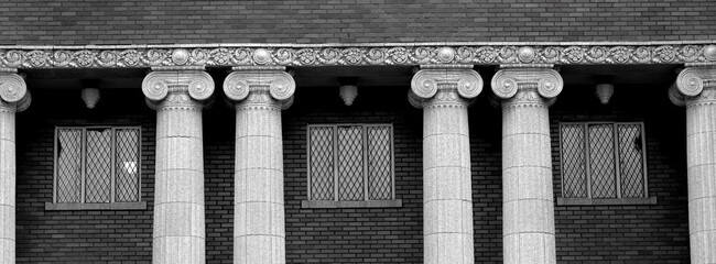 Naklejka premium Old Brick City Building in a Small Town in America USA United States with Columns