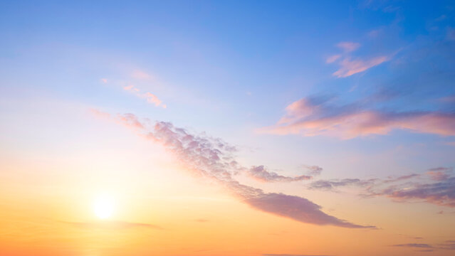 Sunrise sky in the morning with beautiful yellow sunlight and cloud on blue horizon sky background