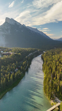 Panoramic aerial shot of Banff National Park with lush green valley in summer