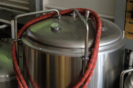 brewery fermentation containers close up fermenter bright tank stainless steel pipe pressure dispensing conditioning fermenting vessel beer ale brewing process transfer lager lagering modern