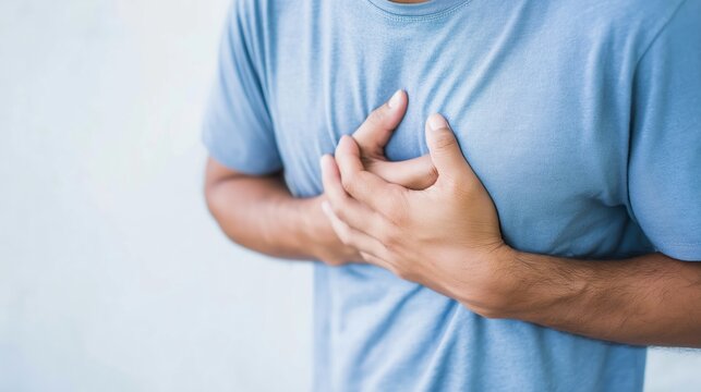 Person experiencing acute chest discomfort or angina due to a heart problem or medical condition, needing urgent attention