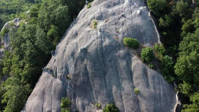 Aerial view of Sasso di Sant'Andrea, a prominent sandstone geological feature surrounded by dense forest. Zocca, Modena, Emilia-Romagna, Italy