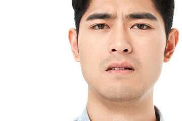 Naklejka premium Close Up Portrait of Worried Young Man with Tense Expression