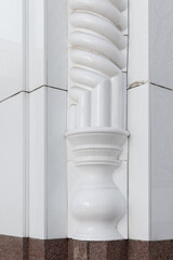 Naklejka premium Close-up of a white ornate architectural column showing classical decorative carving, smooth marble-like texture and precise joint lines. Architecture details of the Minor Mosque, Tashkent, Uzbekistan