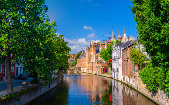 Panorama Bruges cityscape, Brugge old town panoramic view with Groenerei Green Canal water Reie river with embankment in Bruges city historic center, West Flanders province, Flemish Region, Belgium