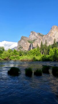 Beautiful view of Yosemite Valley featuring granite cliffs, waterfalls, forest landscapes, mountain scenery, and pristine wilderness in Yosemite National Park, California.