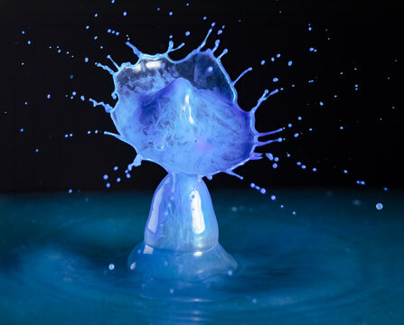 Closeup macro of a vibrant blue splash of water or other liquid