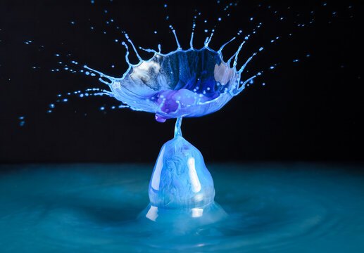 Closeup macro of a vibrant blue splash of water or other liquid