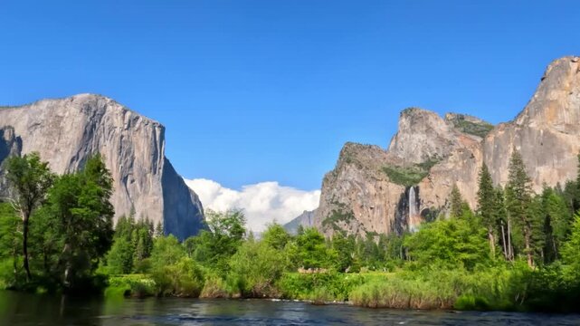 Beautiful view of Yosemite Valley featuring granite cliffs, waterfalls, forest landscapes, mountain scenery, and pristine wilderness in Yosemite National Park, California.