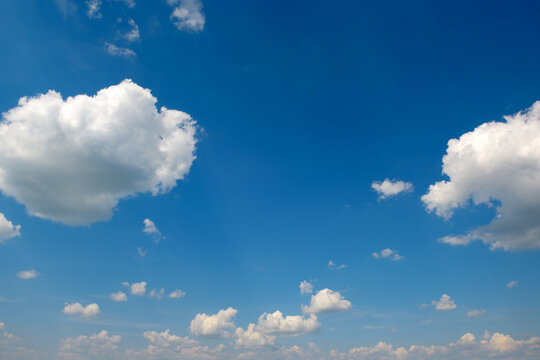 Beautiful Blue Sky with Fluffy White Clouds on Sunny Day, Clean Vivid Heavens Background Content with Ample Copy Space