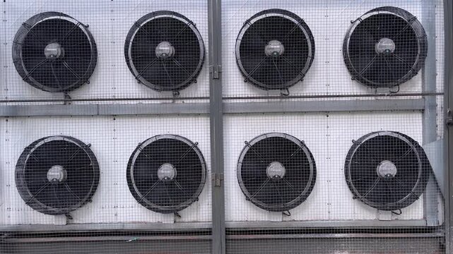 Industrial cooling fans moving air for ventilation system