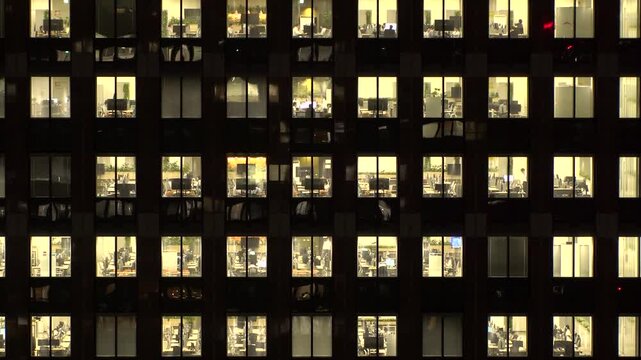 TOKYO, JAPAN : Close up time lapse shot of office building window at night. Job, work, company, corporate and business people concept video.