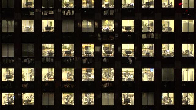 TOKYO, JAPAN : Close up time lapse shot of office building window at night. Job, work, company, corporate and business people concept video.