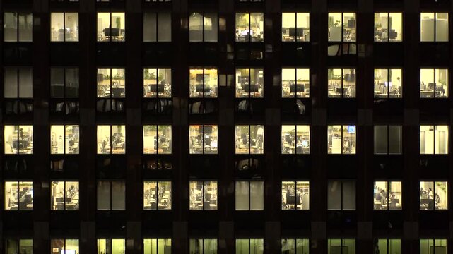 TOKYO, JAPAN : Close up time lapse shot of office building window at night. Job, work, company, corporate and business people concept video.