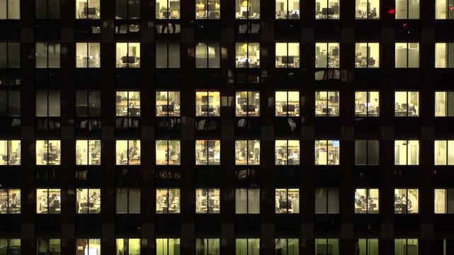 TOKYO, JAPAN : Close up time lapse shot of office building window at night. Job, work, company, corporate and business people concept video.