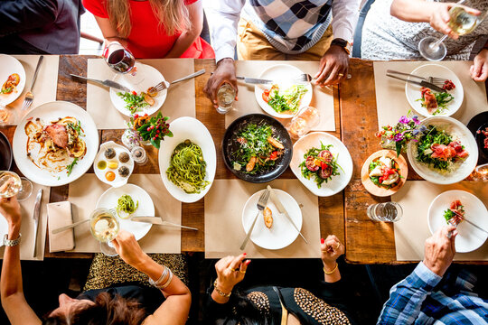 Diverse group enjoying meal together