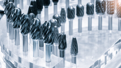 various types of drill bits milling cutter. display is organized and bits are arranged in way that makes it easy to see the differences between them © Aleksandr Matveev