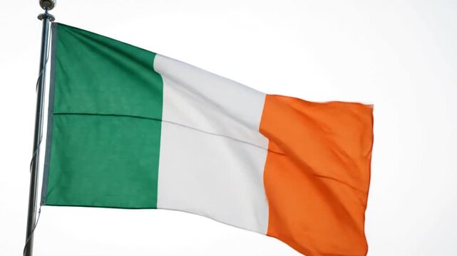 The national flag of ireland waving on a flagpole isolated on white background