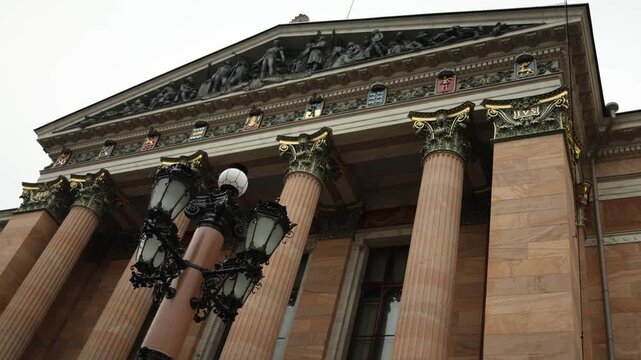 architectural facade of a historic building featuring decorative columns and ornate stucco details showcasing classical design and urban heritage