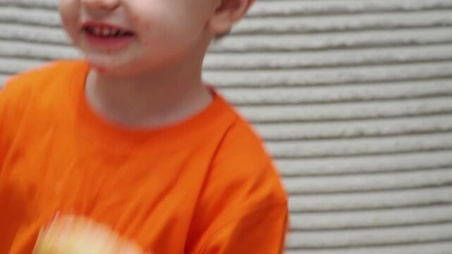 A cute little boy, 2-3 years old, is lounging on the couch, laughing, playing, kicking, misbehaving, and disobeying his mother. Child-rearing challenges