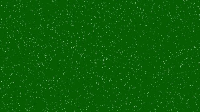 Realistic winter snowfall overlay on green background with falling snowflakes, bokeh light effects, glitter shine layer, slow motion christmas snow animation for festive holiday videos