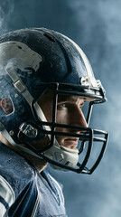 Fototapeta premium Focused male athlete in blue football helmet with foggy background.