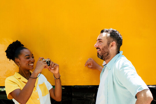 Diverse couple enjoying travel taking memories