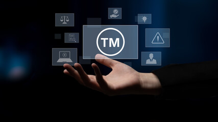 Obraz premium Trademark protection and legal compliance with TM icon, copyright law, patent check, intellectual property rights, and branding regulation enforcement Latch